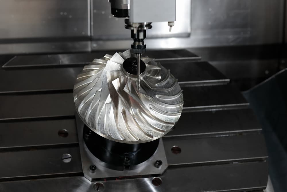 CNC machining an engineered metal component